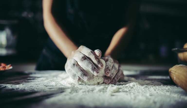 woman-kneads-dough-make-pizza-wooden-cooking-concept (1)